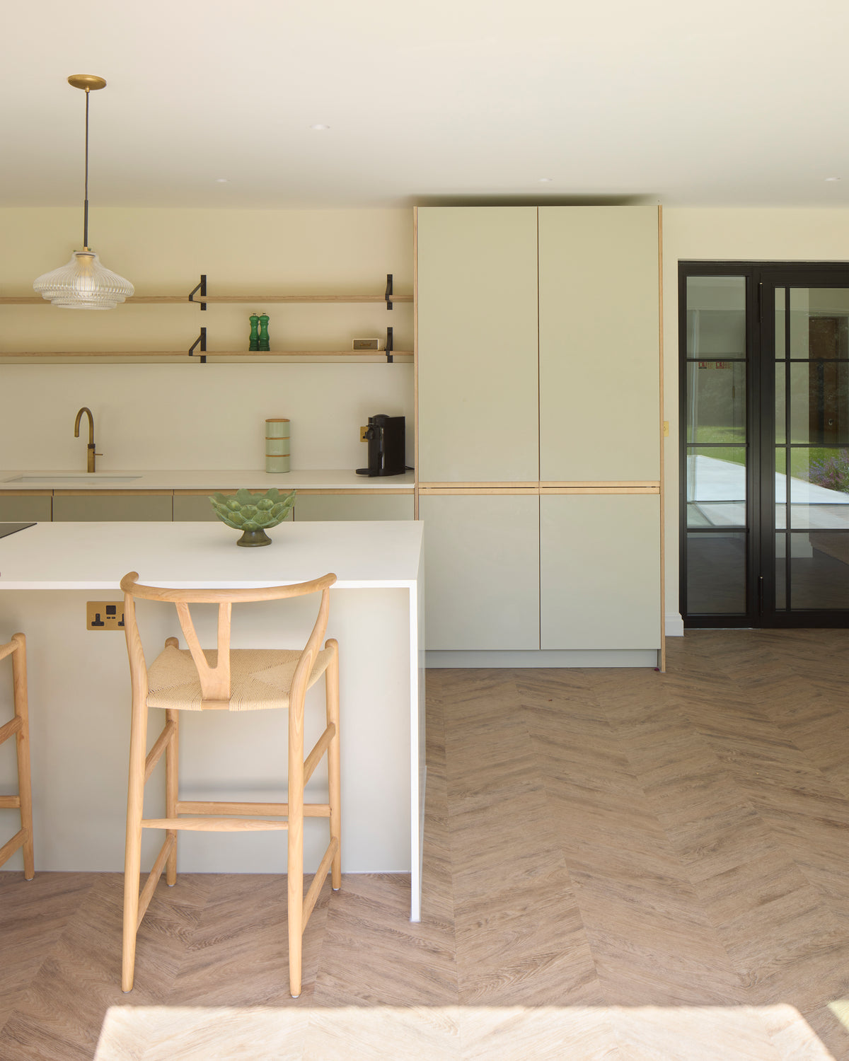 A fully custom Made in Ply kitchen in Winchester, designed for a project by AKA Architects in birch plywood and Formica Seed green.