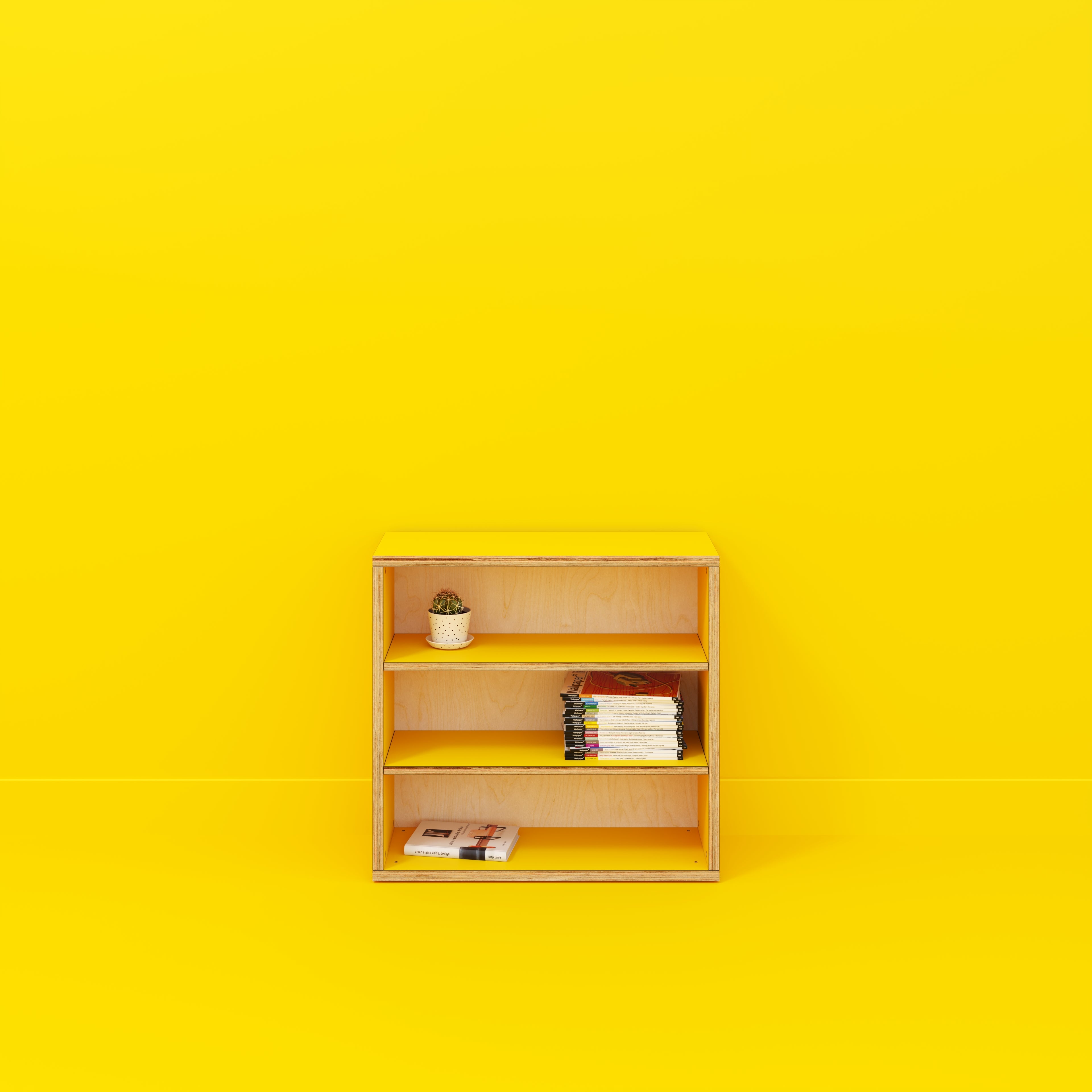 yellow plywood bookshelf