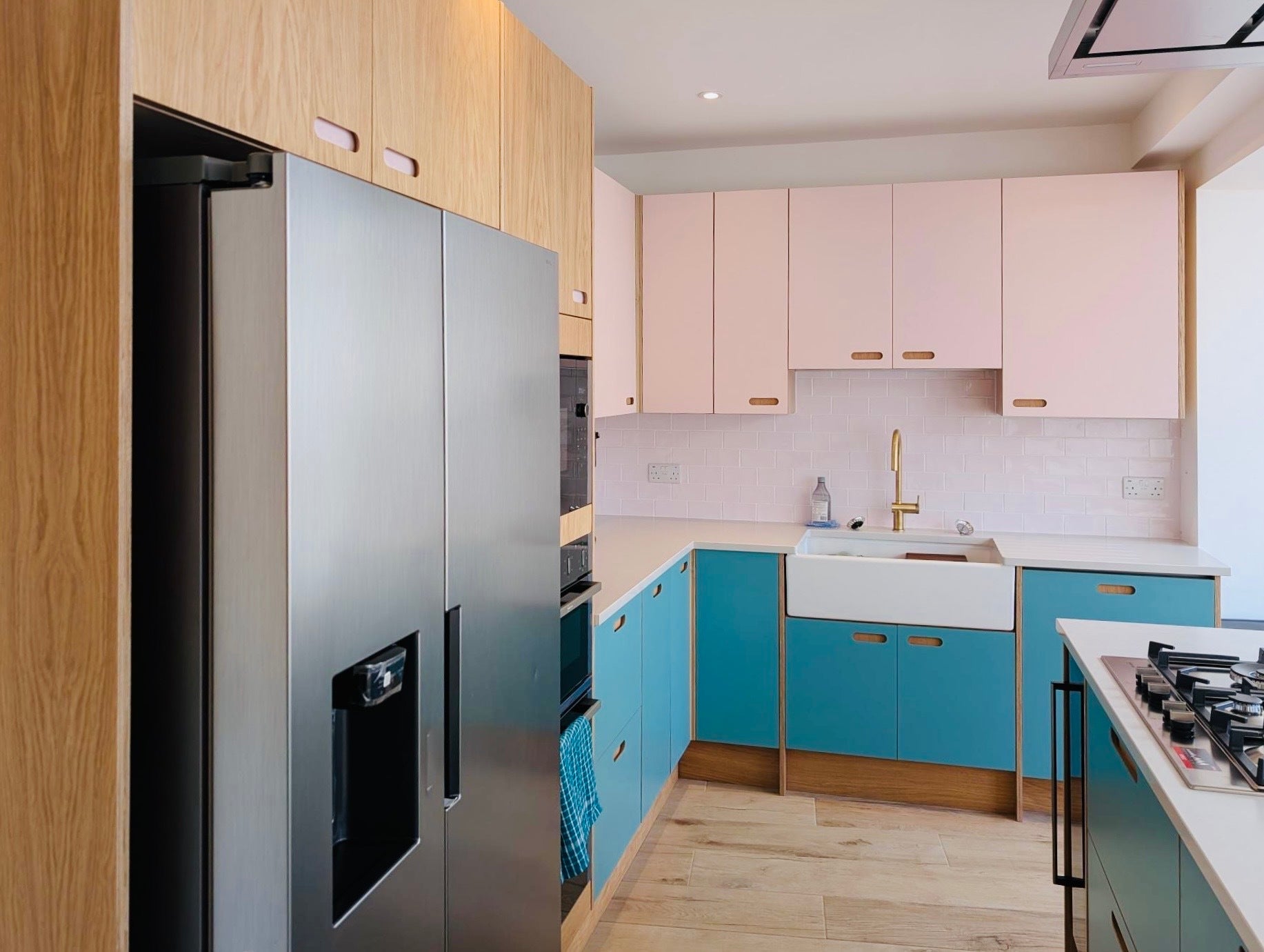 pink and blue oak plywood Howdens kitchen