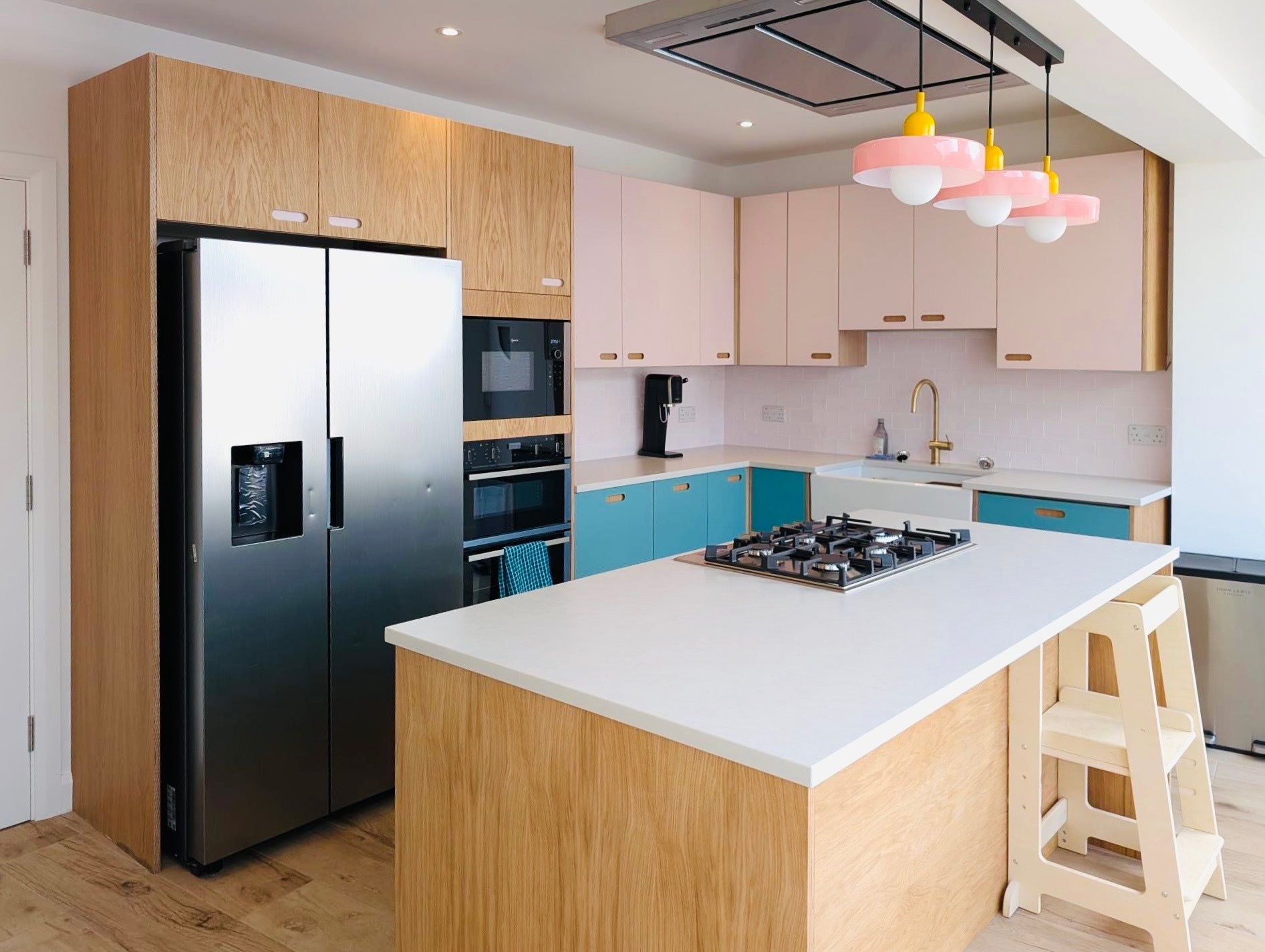 pink and blue plywood kitchen fronts