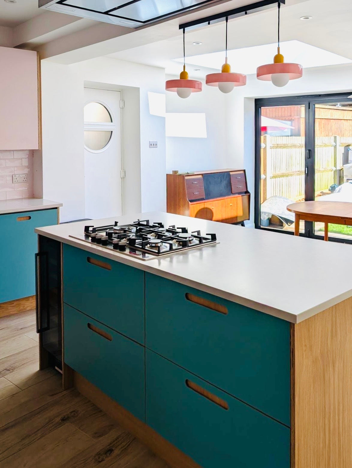 pink and blue oak plywood Howdens kitchen